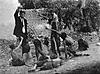 Forged Photo 1: Turkish official teasing Armenian starved children by showing bread, 1915 (Collection of St. Lazar Mkhitarian Congregation